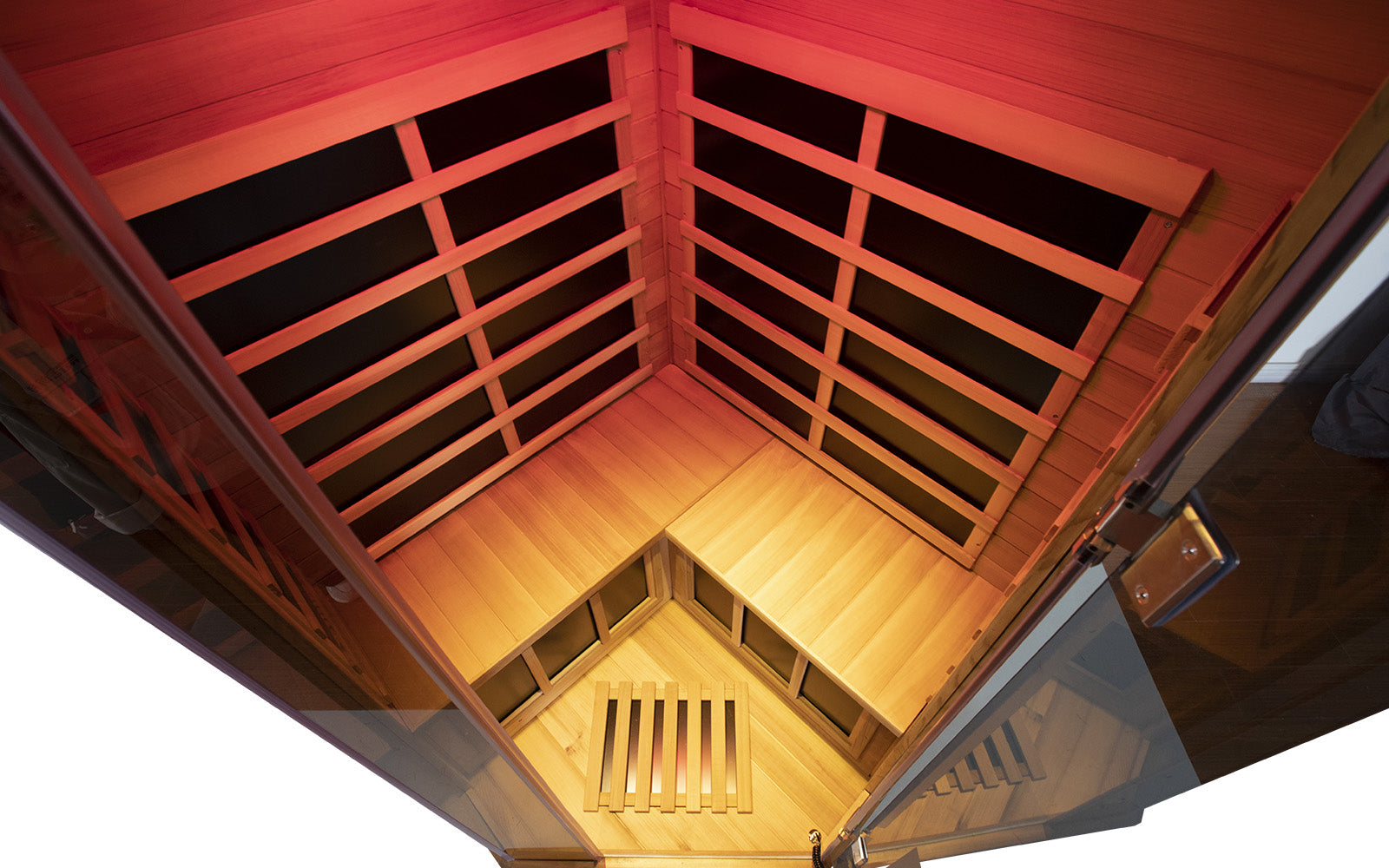 WizziSaunas SR07 Red Cedar Infrared Sauna top-down interior view with glass door showing warm amber therapeutic LED lighting and wooden benches by WizziSauna