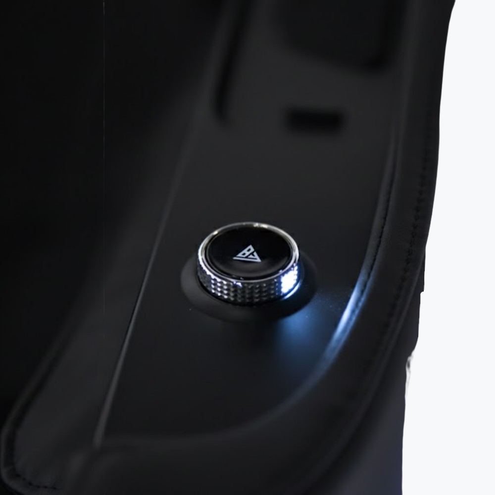 Floridian Brand Rebel 4D Massage Chair illuminated control knob with brand logo and blue LED accent lighting on armrest