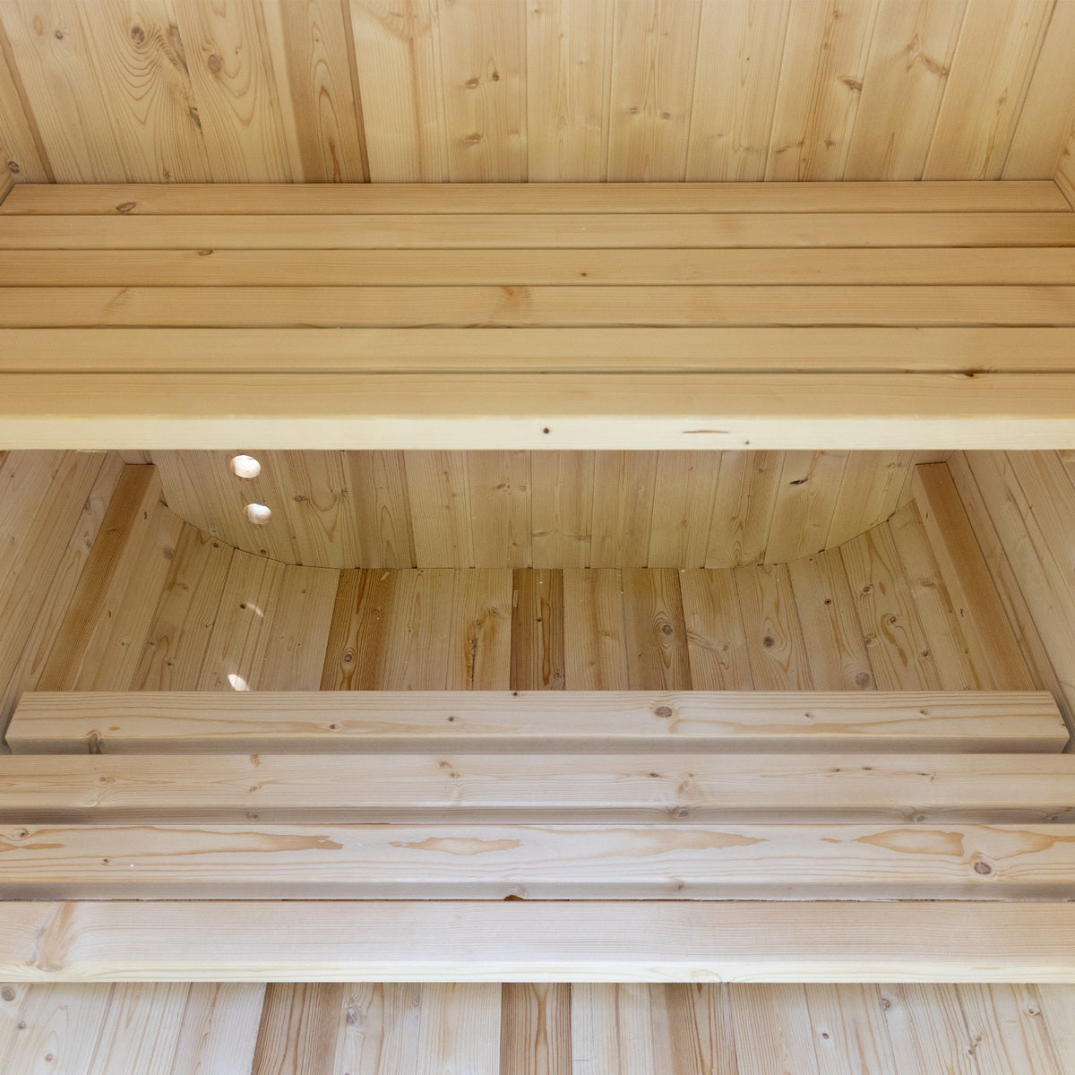 Auris One Luxury Outdoor Cedar Sauna interior bench view showing cedar slat seating rounded barrel ceiling and LED lighting
