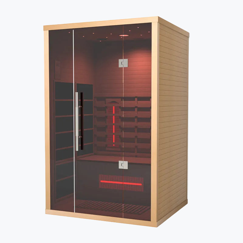 Lumin Two 2-Person Indoor Infrared Sauna front-left angle showing cedar side panel glass door and glowing red vertical infrared heater