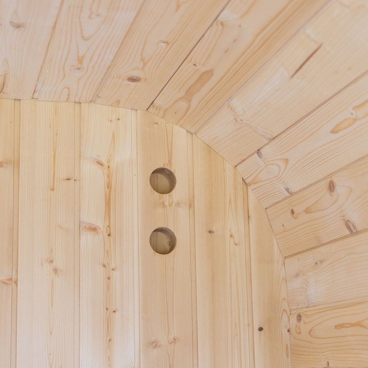 Auris One Luxury Outdoor Cedar Sauna exterior corner close-up showing raw cedar planks and circular ventilation holes