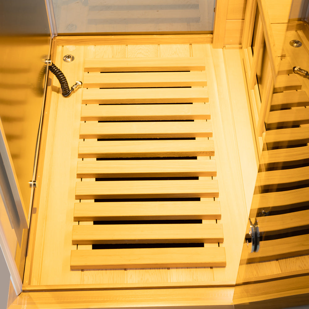 WizziSaunas 909MX Mini red cedar infrared sauna interior bench and floor slats viewed from above.