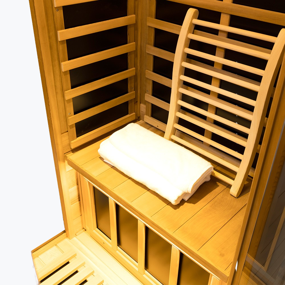 WizziSaunas 909MX Mini red cedar infrared sauna interior showing carbon crystal heating panel