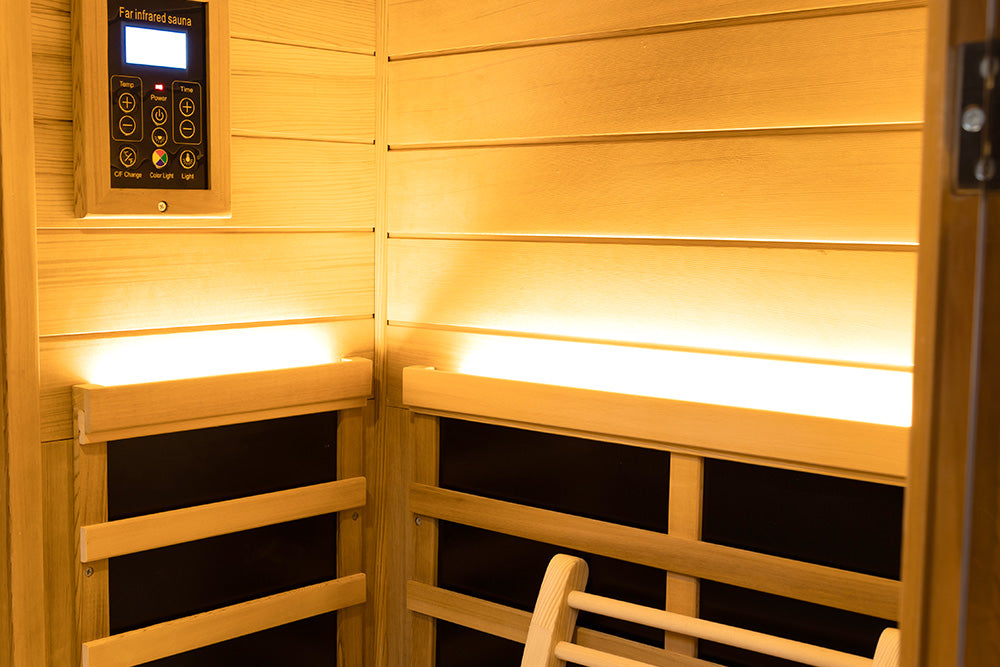 Infrared sauna with wooden interior and control panel.