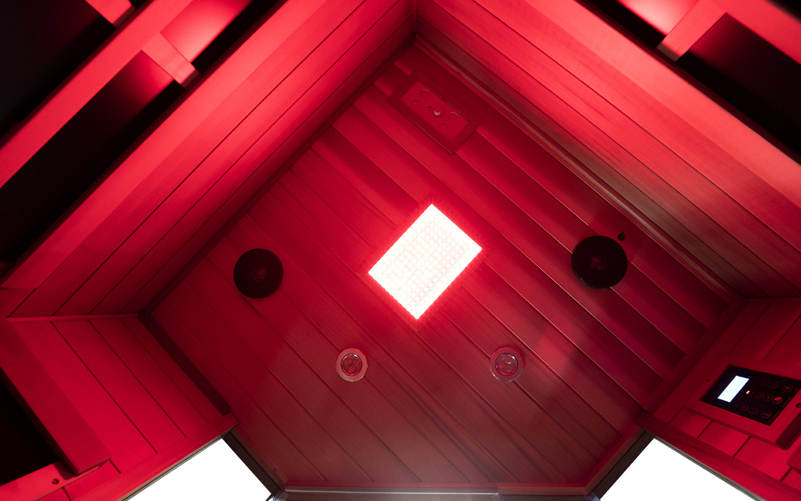 WizziSaunas SR07 Red Cedar Infrared Sauna ceiling view showing full spectrum red LED therapeutic light panel, speakers, and control display by WizziSauna