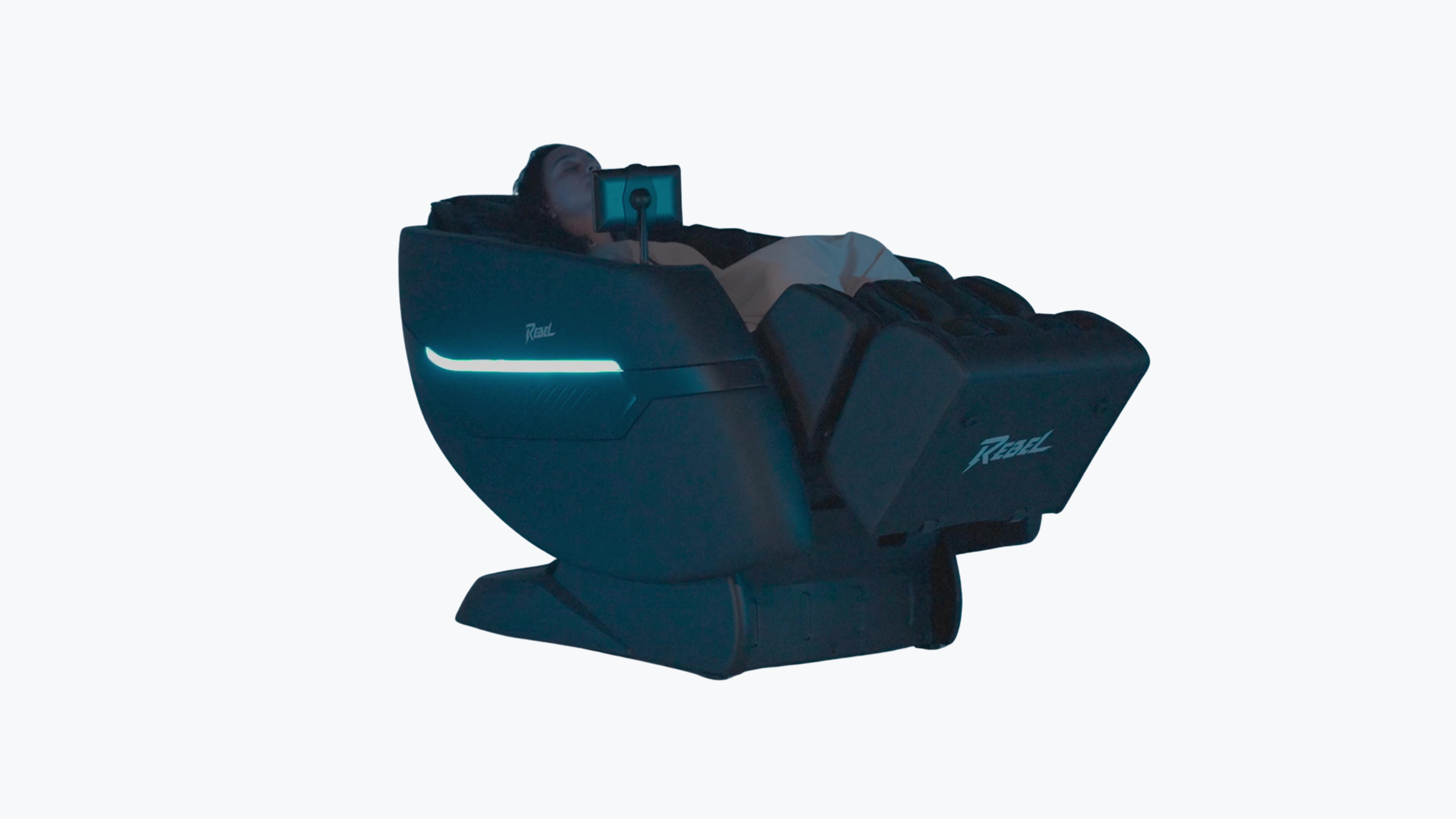 Person relaxing in fully reclined Floridian Brand Rebel 4D Massage Chair with blue LED ambient lighting in studio setting