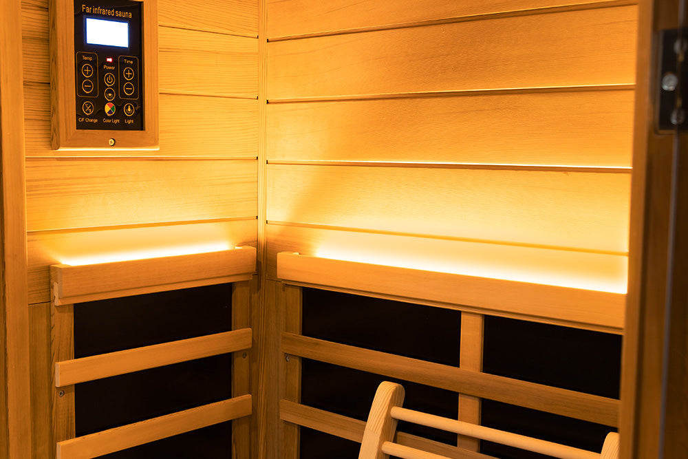 WizziSaunas 909MX Mini red cedar infrared sauna interior with control panel for power, lighting, and temperature.